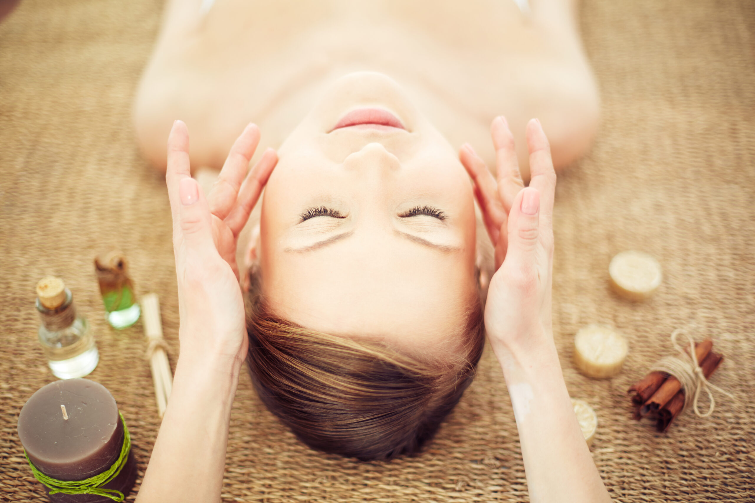 Relaxing woman having a massage for her skin on a face in beauty salon